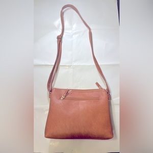 Brand new light brown women’s vegan leather  hand bag.